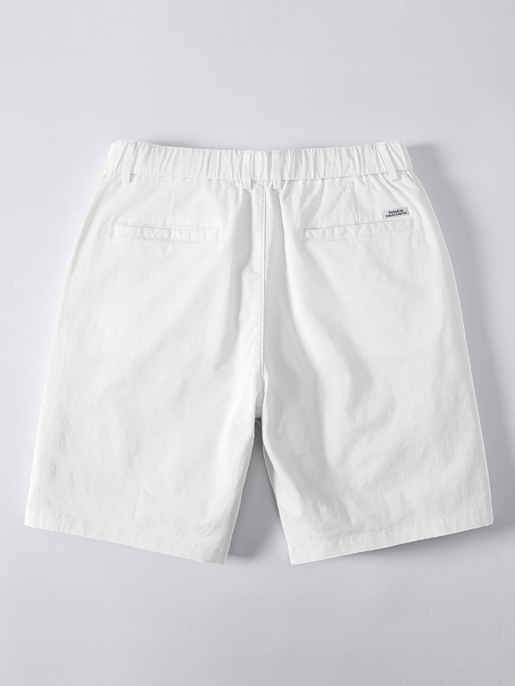 Valkoiset chino-shortsit takaa