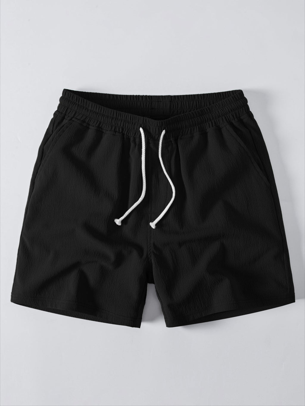 Shortsien etupuoli ja käytännöllinen kiristysnyöri