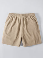 Beiget kreppipintaiset shortsit takaa
