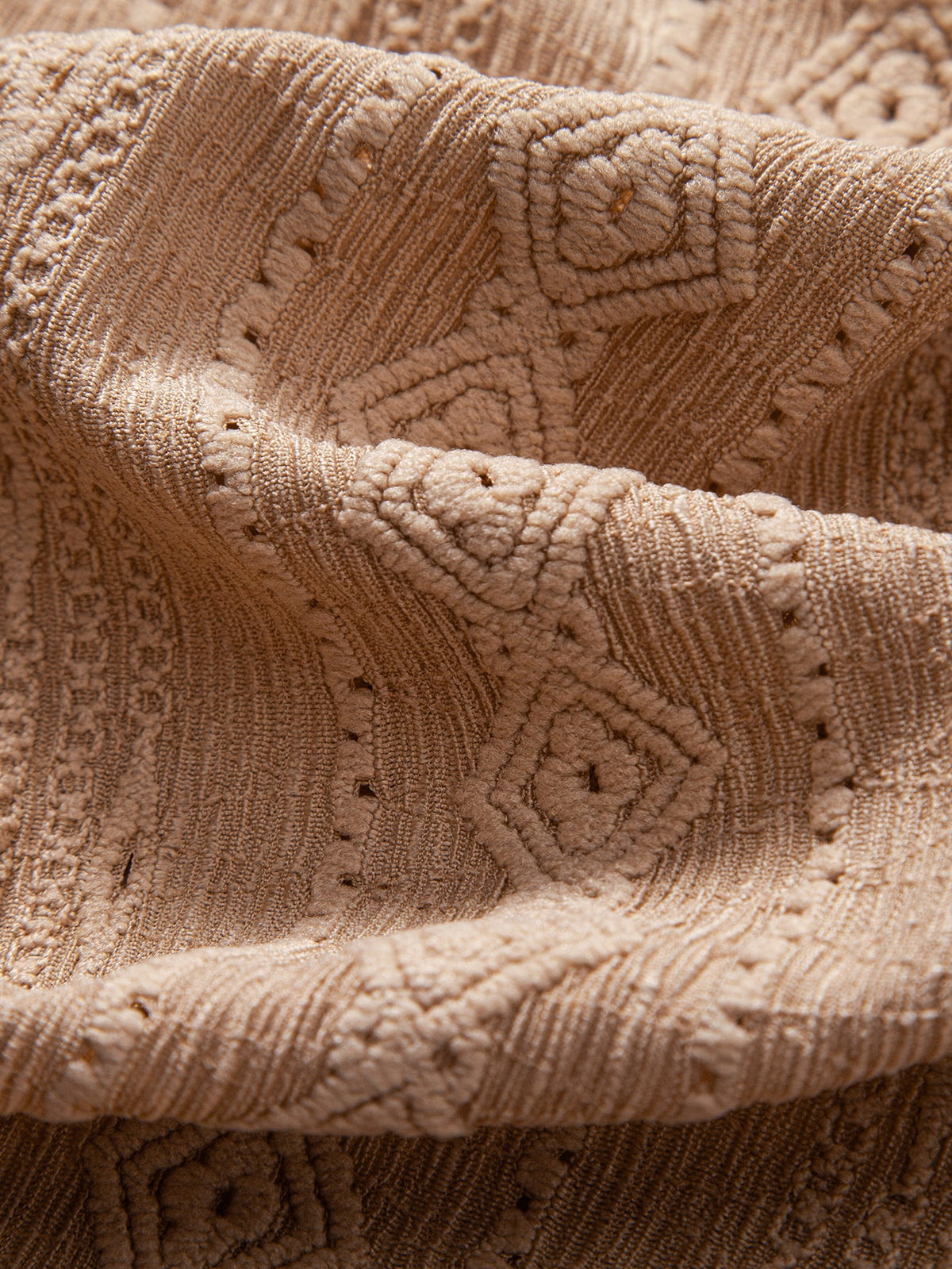Pikeepaidan geometrisen jacquard-kuvion yksityiskohta