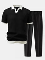 Musta teksturoitu pikeepaita Johnny-kauluksella ja slim fit -housut aikuisen mallin yllä