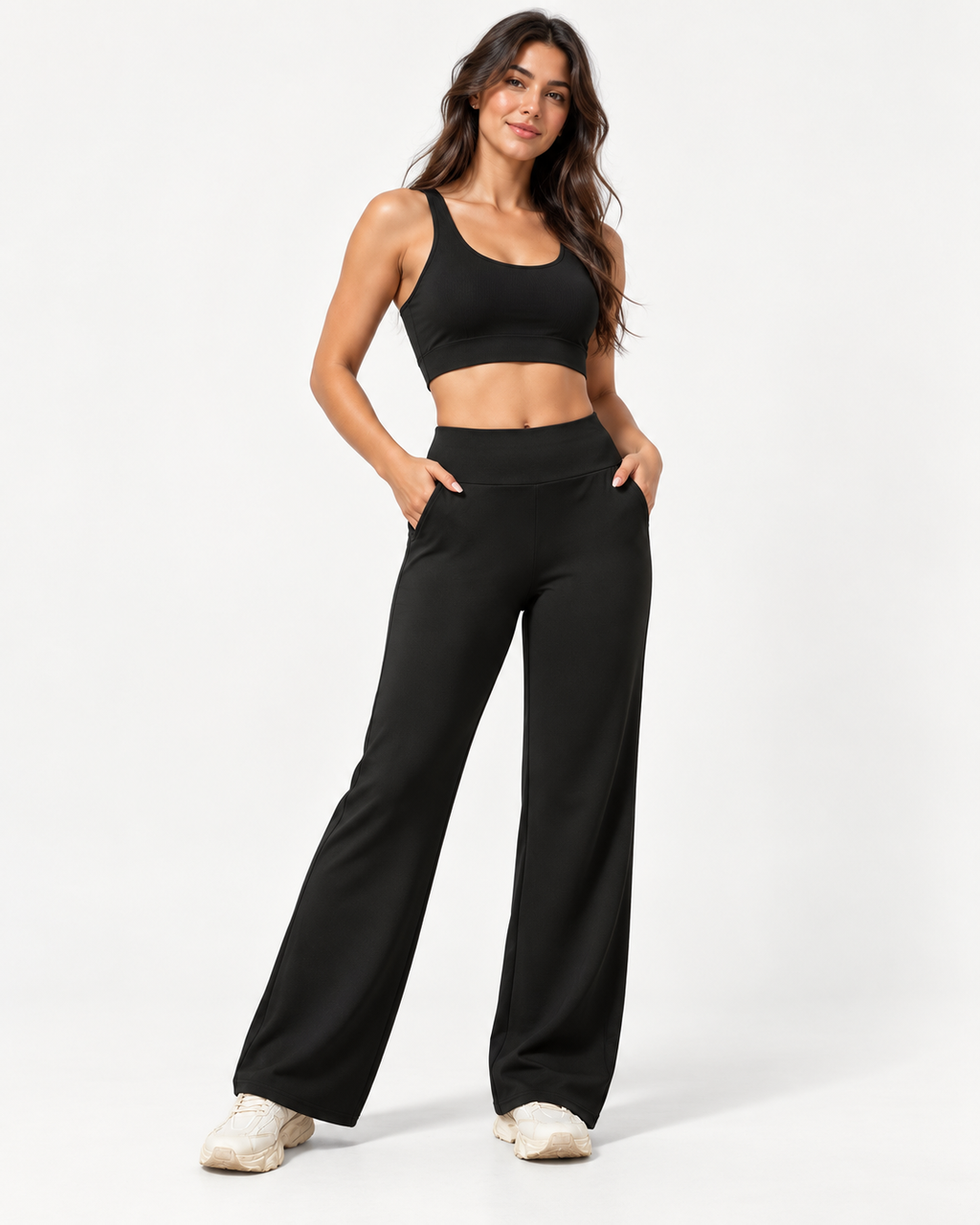 Naisten mustat korkeavyötäröiset leveälahkeiset Fadila-housut kokovartalokuvassa