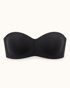 Musta olkaimeton kaaritueton bandeau-rintaliivi, tekninen etukuva lämpimän valkoisella taustalla